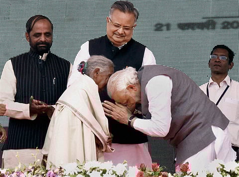 Prime Minister Narendra Modi at the launch of Shyama Prasad Mukherji National Rurban Mission at Kurubhat Rajnandgaon in Chhattisgarh Sunday. Chief Minister of Chhattisgarh Raman Singh and the Minister of State for Chemicals Fertilizers Hansraj Gangaram Ah