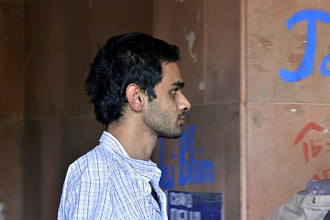 Indian student activist Umar Khalid walks on the campus of New Delhi's prestigious Jawaharlal Nehru University (JNU) in New Delhi on February 22, 2016. Five students wanted in a controversial sedition case that has triggered some of India's biggest stud