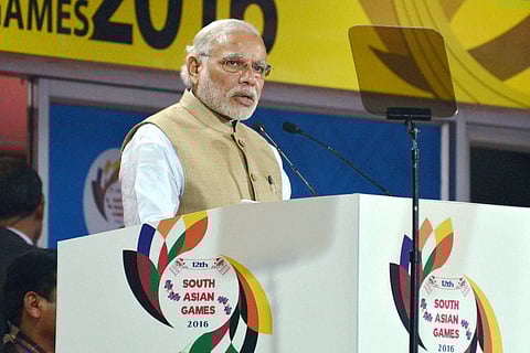 Prime Minister Narendra Modi addresses the gathering at the opening ceremony of the 12th South Asian Games at Sarusajai Sports Complex in Guwahati on Friday. | PTI