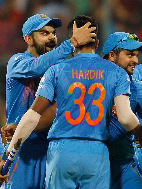 India's Virat Kohli, left, celebrates with team mate Hardik Pandya, center, and Suresh Raina after India's win over Bangladesh in the ICC World Twenty20 2016 cricket match in Bangalore, India, Wednesday, March 23, 2016. | AP