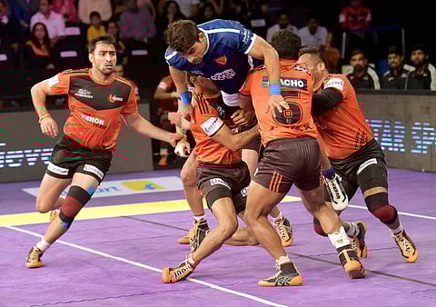 Players of U Mumba and Dabang Delhi in action during the Pro Kabaddi match played in Mumbai on Wednesday. | PTI