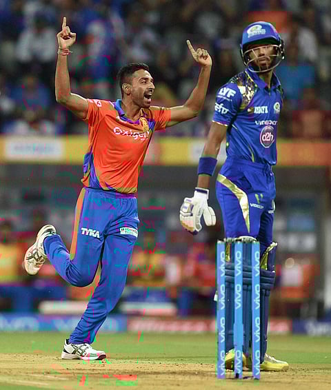 Gujarat Lions bowler Dhawal Kulkarni celebrates the wicket of Mumbai Indians batsman Hardik Pandya. | PTI