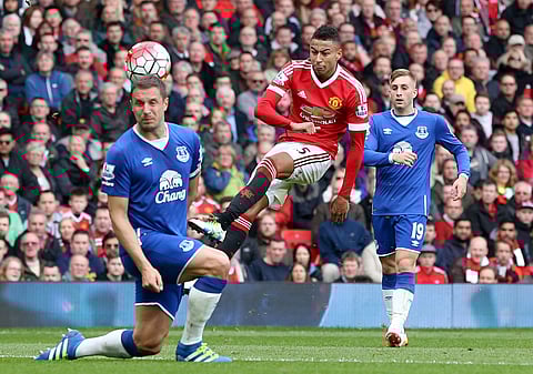 Manchester United's Jesse Lingard, centre, makes a shot on goal, during the English Premier League soccer match between Manchester United and Everton, at Old Trafford, in Manchester, England, Sunday April 3, 2016. | AP