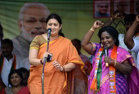 Union Minister Smriti Irani and Thamilisai Soundarrajan, BJP Candidate for Virugambakkam at the public meeting in Chennai On Friday. (EPS | R.Satish Babu)