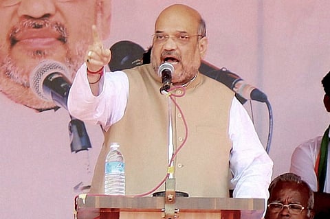 BJP national president Amit Shah addressing a public meeting at Old Helipad ground in Puducherry on Saturday. | PTI