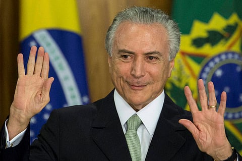 Brazil's acting President Michel Temer arrives to speak in Planalto presidential palace in Brasilia after the Senate voted to suspend President Dilma Rousseff pending an impeachment trial. | AP