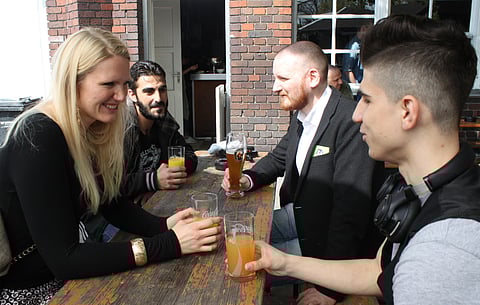 Cindy Spieker, Ahmed Haj Ali, Paul Spieker and Abdul Wahab, from left, met through a website called 'Let's integrate!' that sets dates between refugees and locals in Berlin. (AP)