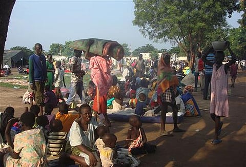 At least 3000 displaced women, men and children gather to seek shelter in Juba, South Sudan at the UN compound in Tomping area, Monday. (AP)