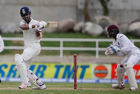 India's Lokesh Rahul hits a four off West Indies' Devendra Bishoo during day one of their second cricket Test match at the Sabina Park Cricket Ground in Kingston Jamaica Saturday July 30 2016. | AP