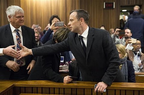 Oscar Pistorius, right, arrives inside the High Court in Pretoria, South Africa, Wednesday, July 6, 2016.| AP