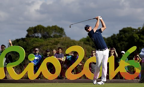 Justin Rose, of Great Britain, tees off on the 16th hole during the first round of the men's golf event at the 2016 Summer Olympics in Rio de Janeiro, Brazil, Thursday, Aug. 11, 2016. | AP