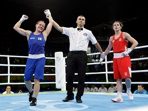 Finland's Mira Potkonen, left, reacts as she won a women's lightweight 60-kg quarterfinals boxing match against Ireland's Katie Taylor at the 2016 Summer Olympics in Rio de Janeiro, Brazil, Monday, Aug. 15, 2016. | AP