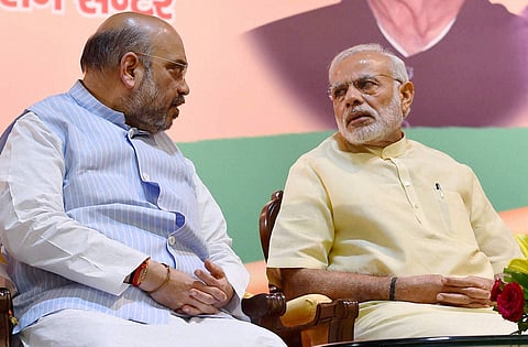 Prime Minister Narendra Modi with BJP president Amit Shah at the concluding session of party's core committee meeting of all state units in New Delhi on Tuesday. PTI