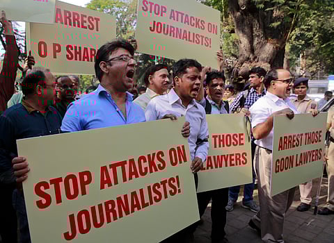FILE - In this Feb. 17, 2016, Indian journalists hold placards during a protest against attack on journalists in Mumbai. (File Photo | AP)