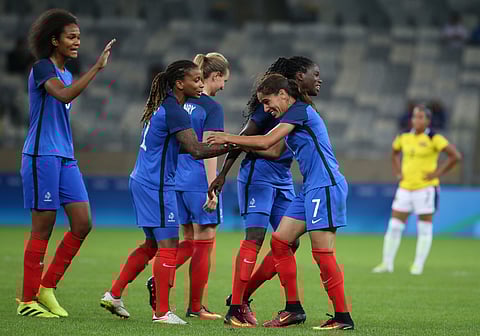 France's Amel Majri, right, celebrates with teammates after scoring against Colombia during the Women's Olympic Football Tournament at the Mineirao stadium in Belo Horizonte, Brazil, Wednesday, Aug. 3, 2016. | AP