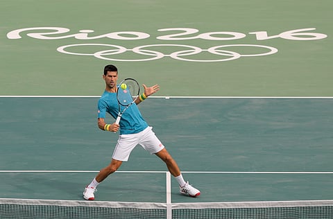 Serbia's Novak Djokovic returns a ball during a practice session on the central court ahead of the upcoming 2016 Summer Olympics in Rio de Janeiro, Brazil. (AP)