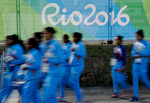 Members of the Indian women's field hockey team walk through the Olympic athletes village in Rio de Janeiro, Brazil. (AP)