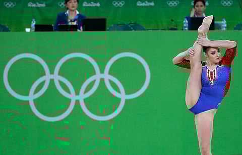 Russia's Aliya Mustafina performs on the floor during the artistic gymnastics women's qualification at the 2016 Summer Olympics in Rio de Janeiro, Brazil, Sunday, Aug. 7, 2016. | AP
