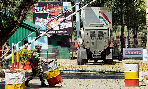Army personnel in action inside the Army Brigade camp during a terror attack in Uri, Jammu and Kashmir on Sunday. (PTI )