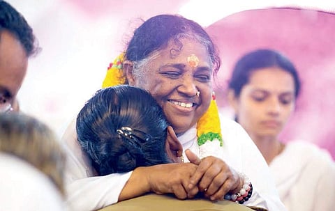 Amma giving darshan to devotees at Amritapuri on Tuesday