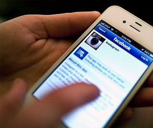 An Instagram photo is shared with Facebook (File photo/AP)