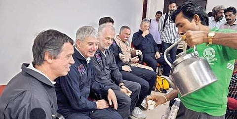 Pilots participating in the air show enjoy a cup of tea in Vijayawada on Wednesday | P Ravindra Babu