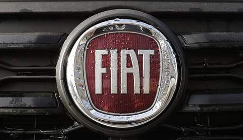 The Fiat logo on a car on display in a car reseller in Milan (Photo | AP)