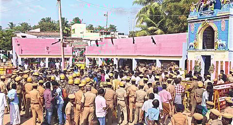 People thronging outside a temple on Sunday to watch a Jallikattu event | Express