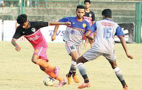 Christ College’s Safeer T A and Shabir A K try to stop a Payyannur College attack during the pre-quarterfinals of TNIE GOAL 2017 at Malappuram District Sports Council Stadium on Sunday. (Bottom) Kerala Hotel and Restaurant Association president Moideenkut