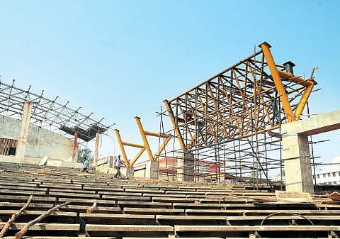 Workers busy erecting steel frames as renovation of Gurazada Appa Rao open air auditorium going on at a brisk pace, in Visakhapatnam on Monday | Express
