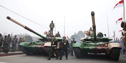 A soldier stands atop an army tank during rehearsals for the upcoming Republic Day parade in New Delhi. | EPS (Shekhar Yadav)