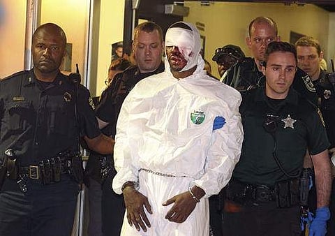 Markeith Loyd is escorted out of the Orlando Police headquarters in Orlando, Fla., Tuesday, Jan. 17, 2017. The suspect in the fatal shooting of an Orlando police officer was captured Tuesday night