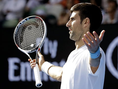 Serbia's Novak Djokovic gestures while playing Uzbekistan's Denis Istomin during their second round match at the Australian Open tennis championships in Melbourne, Australia. | AP