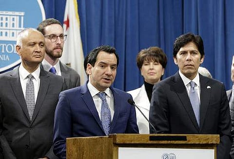 In this photo taken Monday, Dec. 5, 2016, California Assembly Speaker Anthony Rendon, D-Paramount, third from left, flanked by Senate President Pro Tem Kevin de Leon, D-Los Angeles, right, and other Democratic lawmakers, discusses a pair of proposed measu