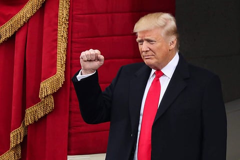 President-elect Donald Trump pumps his fist as he arrives during the 58th Presidential Inauguration at the US Capitol in Washington. | AP