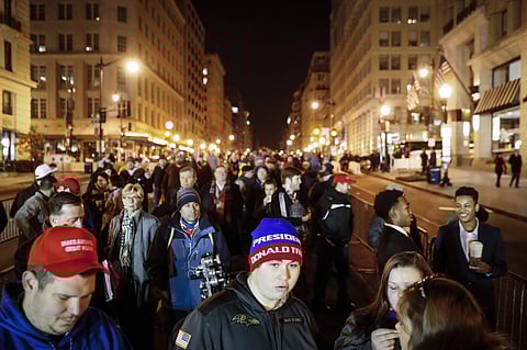 Spectators wait in line to pass through security checkpoints of President-elect Donald Trump's inauguration, Friday, Jan. 20, 2017, in Washington. | AP