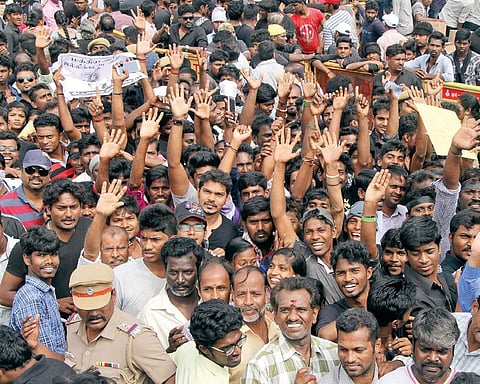 Youth staging a protest on the Marina (Photo | EPS)