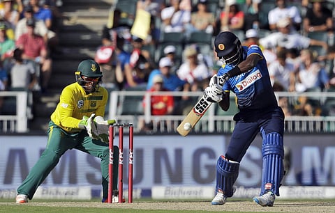Sri Lanka's captain Angelo Mathews, right, plays a shot as South Africa's wicketkeeper Mangaliso Mosehle, watches during the T20 cricket match between South Africa and Sri Lanka, at the Wanderers stadium in Johannesburg, South Africa, Sunday, Jan. 22, 201
