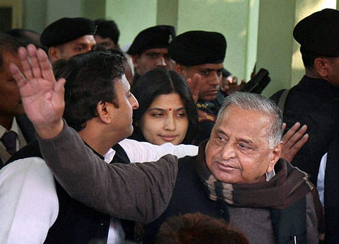 Uttar Pradesh Chief Minister and newly appointed party president Akhilesh Yadav with Mulayam Singh Yadav Dimple Yadav at party office in Lucknow on Sunday. (File | PTI)