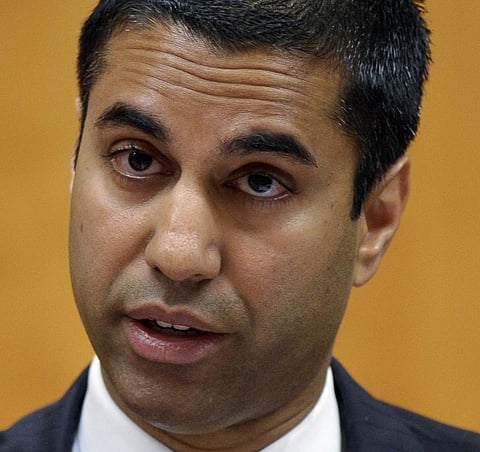 In this Aug. 9, 2013, file photo, FCC commissioner Ajit Pai presents his dissent during a Federal Communications Commission (FCC) hearing at the FCC in Washington. President Donald Trump has picked Pai, a fierce critic of the Obama-era 'net neutrality' ru