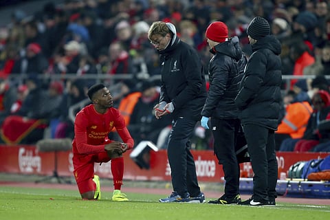 Liverpool's head coach Juergen Klopp, second left, talks to Daniel Sturridge, left, during the English League Cup semifinal 2nd leg soccer match between Liverpool and Southampton at Anfield stadium in Liverpool, England, Wednesday, Jan. 25, 2017. | AP