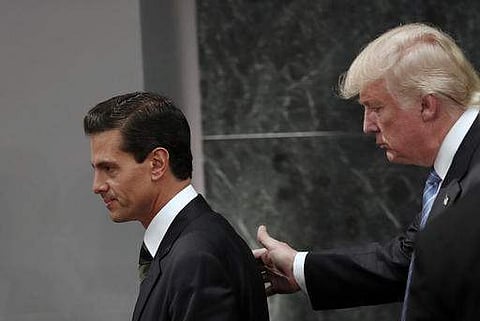 In this Aug. 31, 2016 file photo, Republican presidential nominee Donald Trump walks with Mexico President Enrique Pena Nieto at the end of their joint statement at Los Pinos, the presidential official residence, in Mexico City.|AP