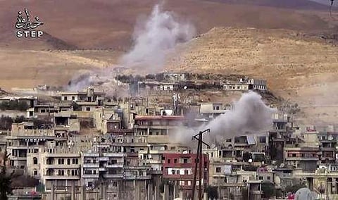 smoke rise from the government forces shelling on Wadi Barada, northwest of Damascus, Syria. AP