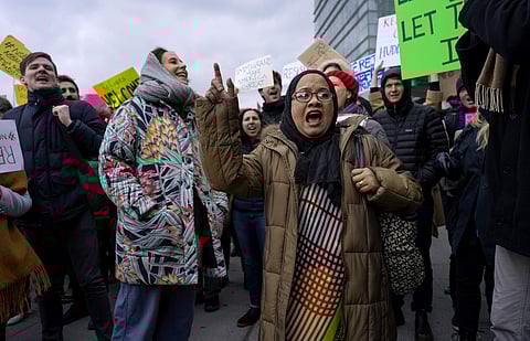 Protesters assemble at John F. Kennedy International Airport in New York, Saturday, Jan. 28, 2017 after two Iraqi refugees were detained while trying to enter the country. | AP