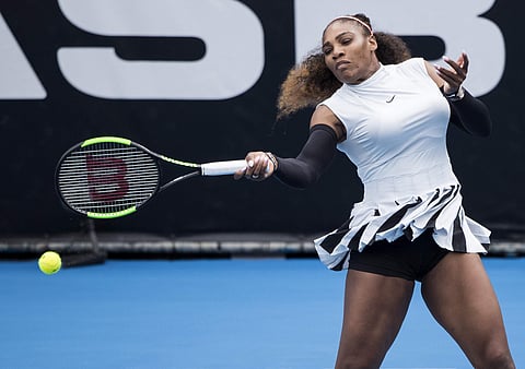 Serena Williams hits a forehand during her first round match against Pauline Parmentier of France at the ASB Classic tennis tournament in Auckland. | AP