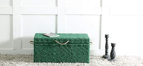 Place a trunk or chest of drawers to create drama.