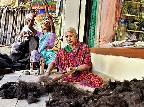 Bhummava, a Gongadi weaver, busy demonstrating weaving skills at the Gongadi exhibition in the Hyderabad on Friday | Vinay Madapu