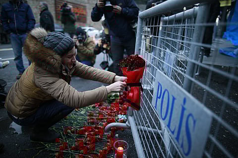 A young woman cries as she leaves flowers for the victims outside a nightclub which was attacked by a gunman overnight, in Istanbul, on New Year's Day, Sunday, Jan 1, 2017. (Photo | AP)