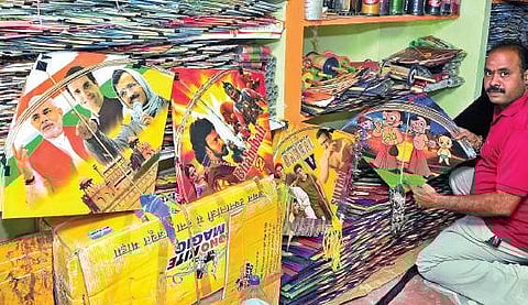 A trader sorts out kites of various designs at his shop at Allipuram in Visakhapatnam on Sunday | Express