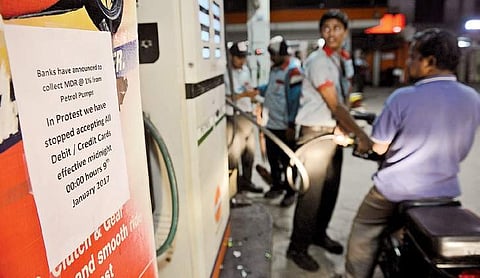 A pamphlet on display announcing petrol pumps’decision of not using credit and debit cards with effect from January 9 in Hyderabad on Sunday | R Satish Babu